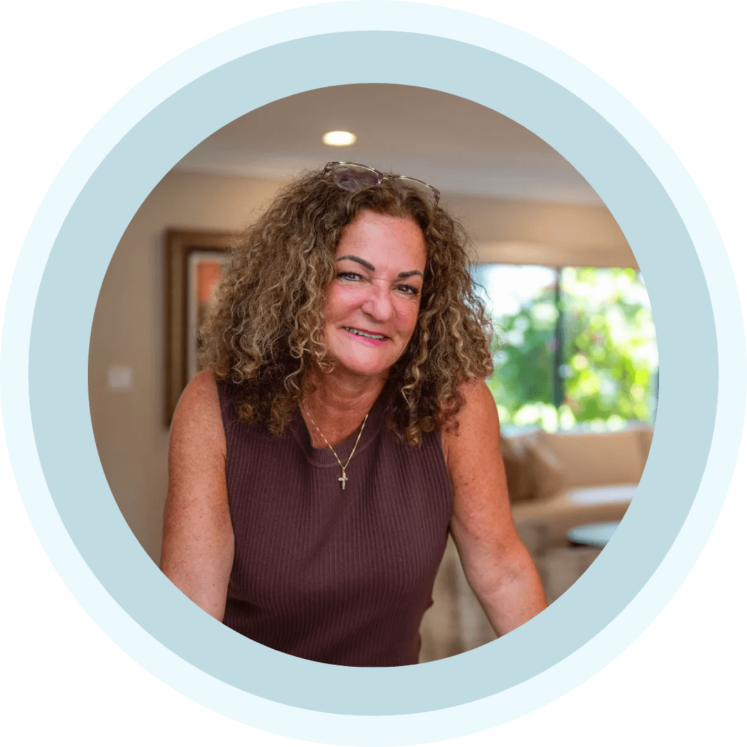 Smiling curly-haired woman in cozy living room