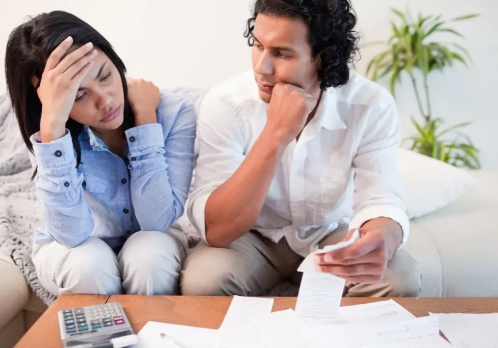 Man and woman discussing financial documents